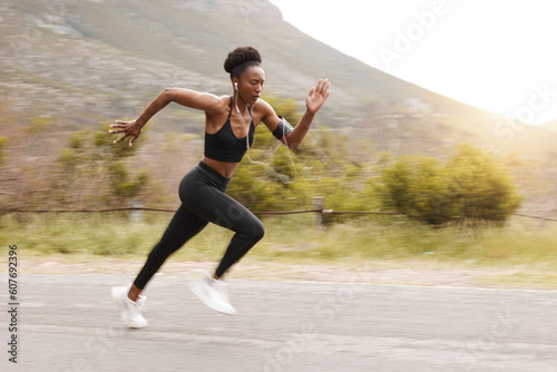 Athlete, fitness and fast black woman running and training for outdoor sports, workout and exercise for a marathon. Strong, wellness and healthy female person or runner with speed for health