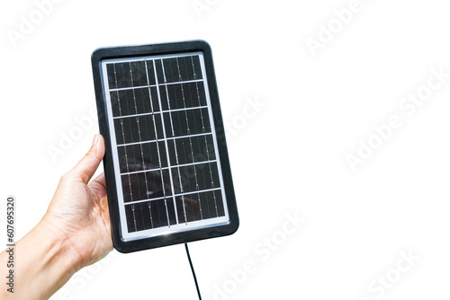 Portable solar cell panel in girl hand isolate on white background, green energy concept, sustainability, solar cell phone charger