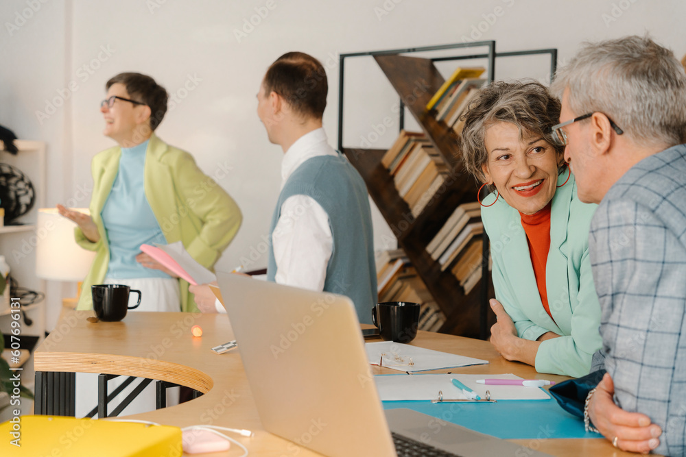 Business people talking in studio, taking a break during recording online class Business people talking in studio, taking a break during recording online class