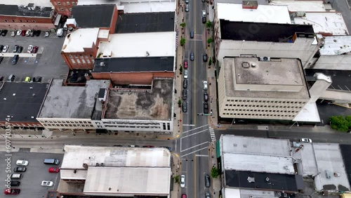 Aerial tilt down over Bristol Tennessee, Virginia Roads, Skyline and Businesses photo