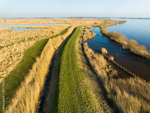 Aerial view of dike between nature reserve Tetjehorn and lake Schildmeer, 't Roegwold, province of Groningen, The Netherlands.