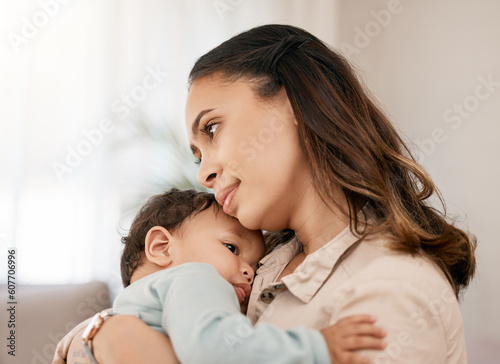 Family, love and mother carry baby for bonding, quality time and loving embrace together at home. New born, motherhood and calm mom holding infant for care, support and affection in living room