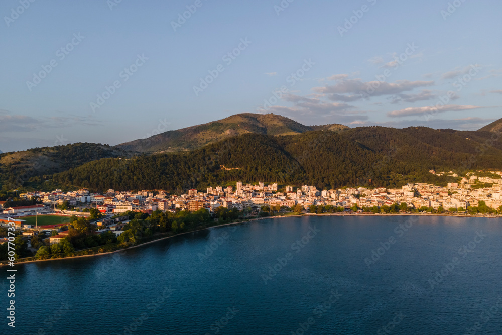 Aerial view of Igoumenitsa at sunset, a small town along the Ionian Sea, Epirus, Greece. Aerial view of Igoumenitsa at sunset, a small town along the Ionian Sea, Epirus, Greece.