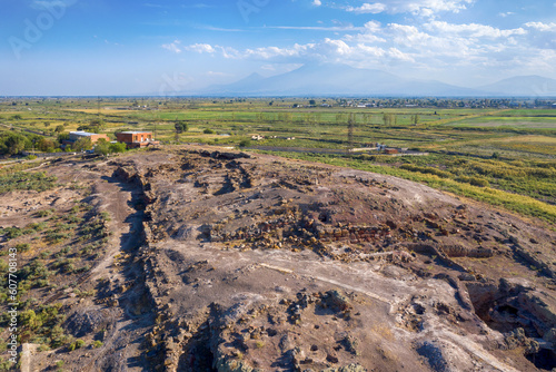 Drone view of Metsamor Archeological Site on the background of Mount Ararat on sunny summer day. Taronik  Armavir Province  Armenia.