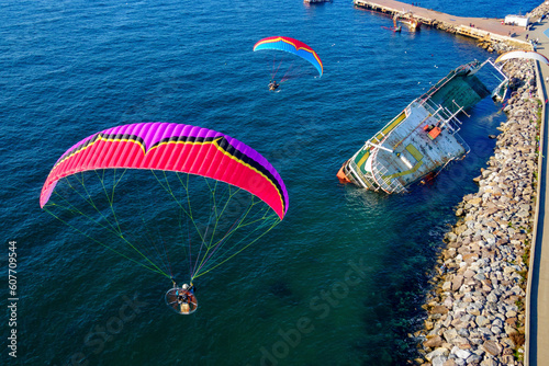 Aerial view of two paramotors flying over a shipwreck in Maltepe district on the Marmara Sea coast of the Asian side of Istanbul, Turkey. photo