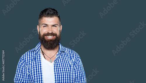 glad bearded man wear checkered shirt on grey background © be free