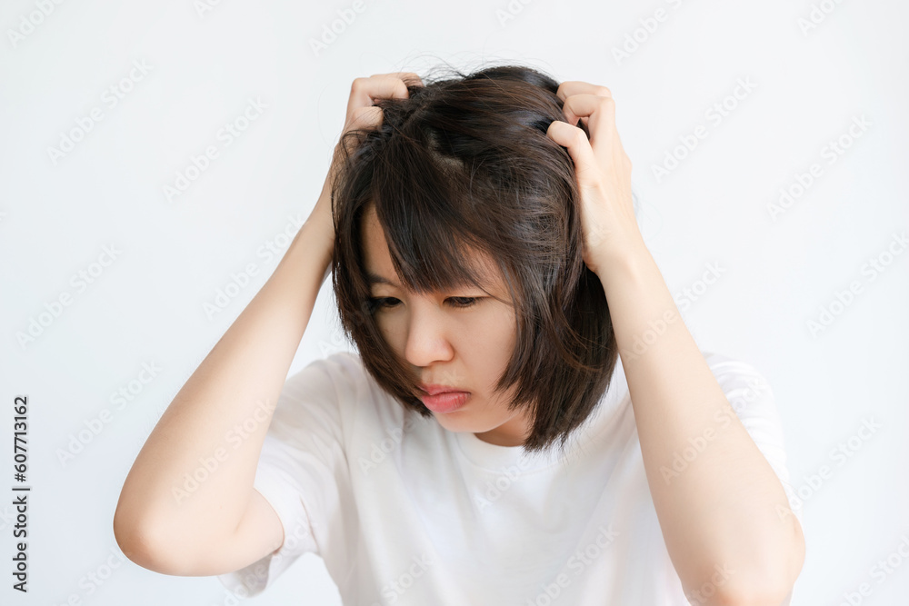 Portrait of Asian woman scratching her head on white background. Portrait of Asian woman scratching her head on white background.