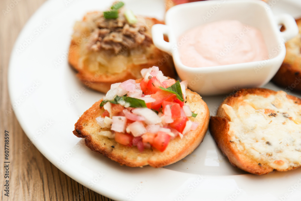 5 kinds of bruschetta served with Belgian Andalouse sauce 5 kinds of bruschetta served with Belgian Andalouse sauce