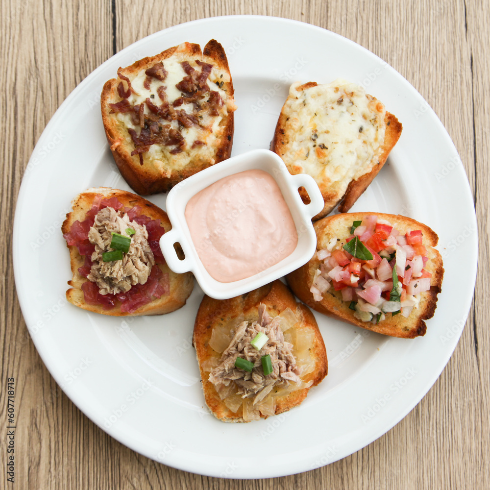 5 kinds of bruschetta served with Belgian Andalouse sauce 5 kinds of bruschetta served with Belgian Andalouse sauce