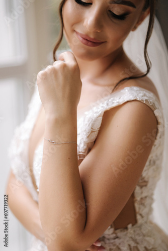 Close-up portrait of elegant woman in luxury wedding dress. Bride morning concept