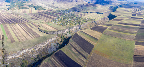 Panoramic aerial view of Dzoraget river canyon and Agarak village on sunny autumn day. Lori Province, Armenia. photo