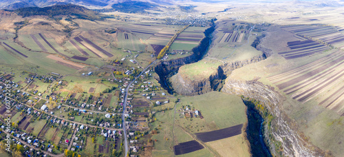 Panoramic aerial view of Dzoraget canyon, Amrakits village and Loriberd fortress on sunny autumn day. Lori Province, Armenia. photo