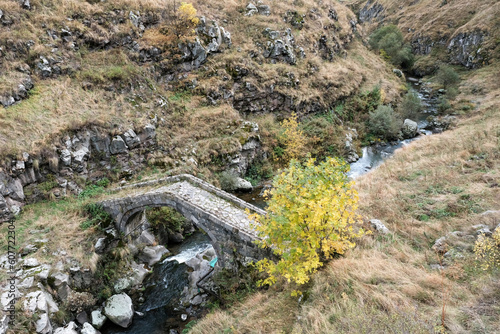 Medieval bridge across Urut (Miskhan) river on cloudy autumn day. Loriberd fortres, Lori Province, Armenia.