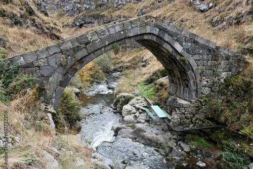 Old stone bridge across Urut (Miskhan) river on autumn day. Loriberd fortres, Lori Province, Armenia. photo