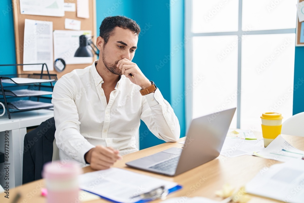 Young hispanic man business worker using laptop working at office Young hispanic man business worker using laptop working at office