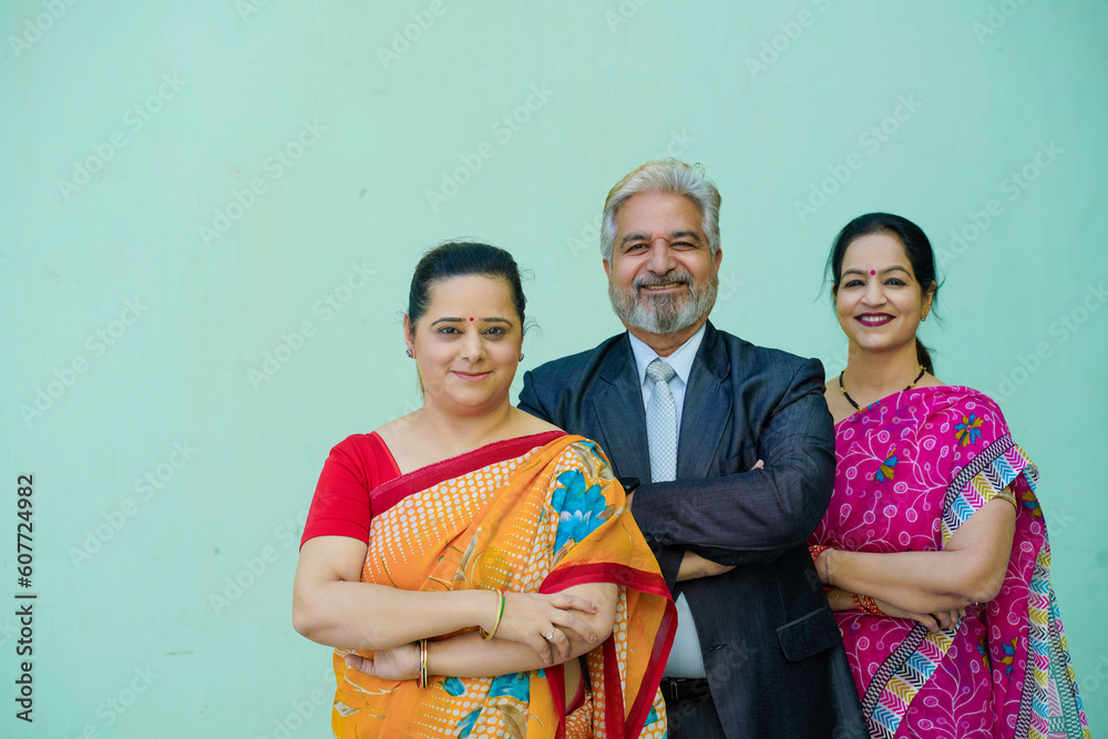 Senior businessman standing with women group. Senior businessman standing with women group.