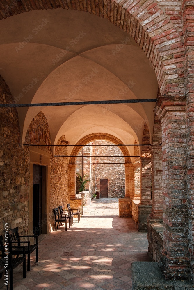 The old Romanesque church with its cloister in Carpegna village in the Marche region in central Italy