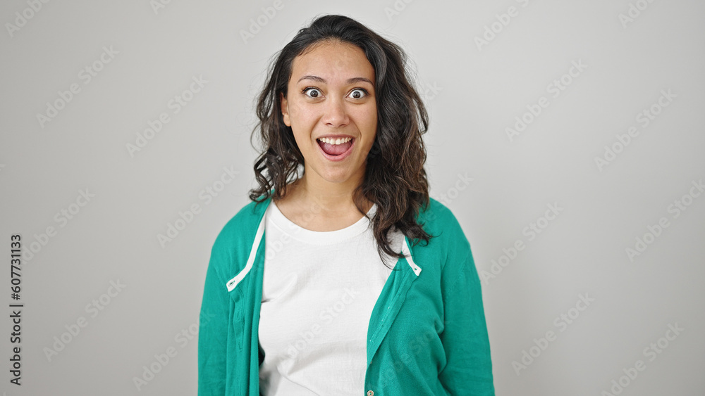 Young beautiful hispanic woman standing with surprise expression over isolated white background Young beautiful hispanic woman standing with surprise expression over isolated white background