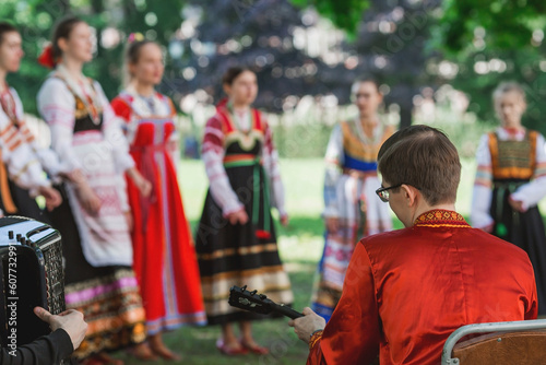 Russian folk traditions. Folk festivals. Children in beautiful Russian traditional outfits sing songs, dance and lead a round dance in Tsaritsyno Park. National Russian clothes. © Юлия Клюева