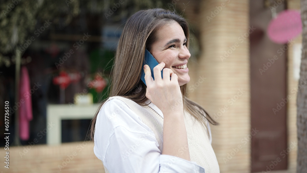 Young beautiful hispanic woman speaking on the phone smiling at street Young beautiful hispanic woman speaking on the phone smiling at street