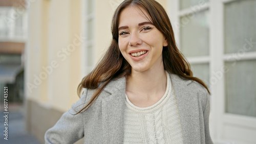Young hispanic woman smiling confident at street