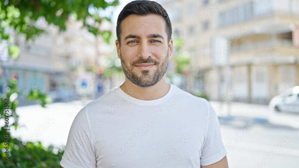Young hispanic man smiling confident standing at street Young hispanic man smiling confident standing at street