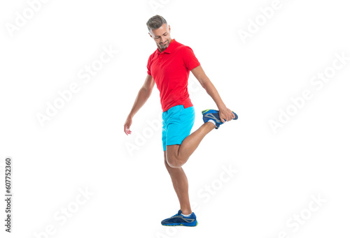 athlete stretching his muscles and preparing for workout. stretching routine of smiling athlete isolated on white. athlete stretching muscles before game. athlete stretching to improve flexibility