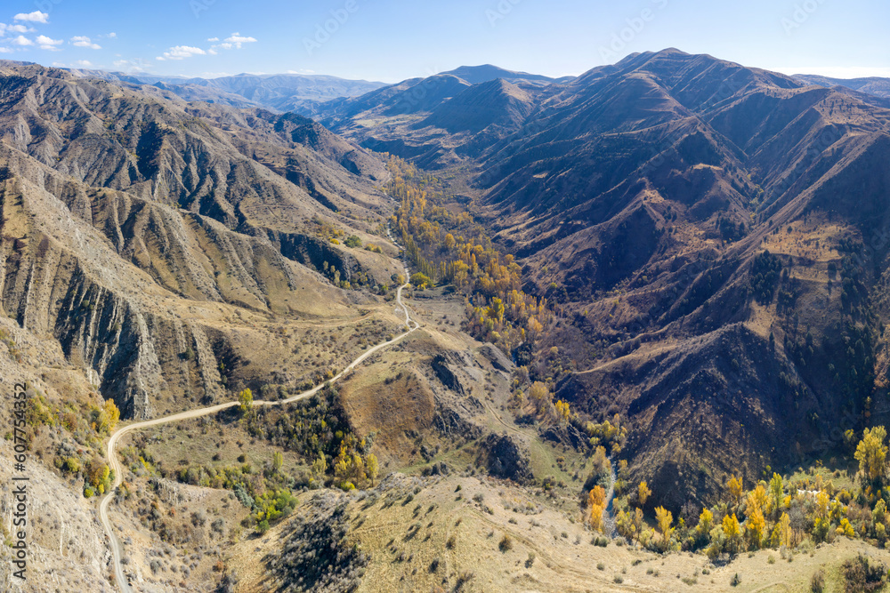 Aerial view of the road going along Mili river on sunny autumn day in Khosrov Reserve. Armenia.