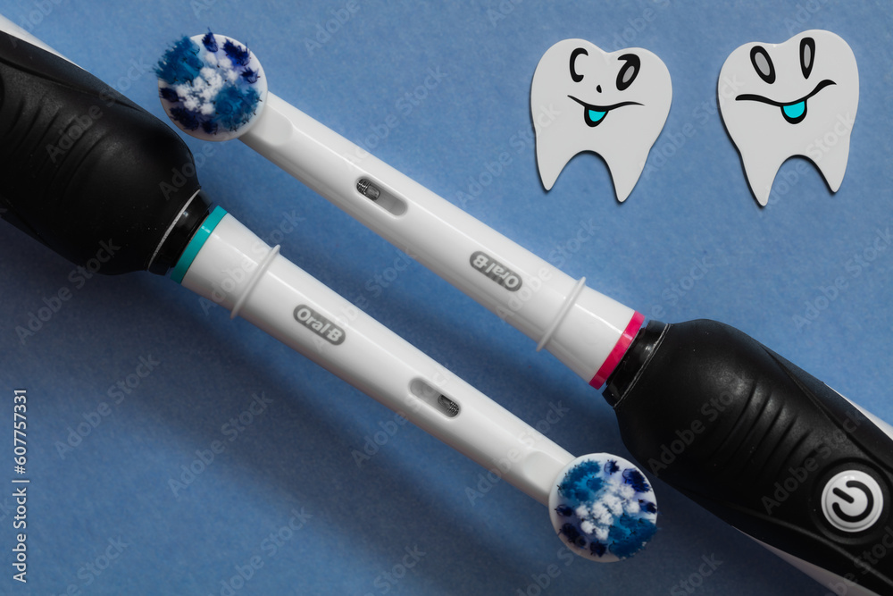 Two Electric toothbrush Oral-B Cross Action PRO 750 black edition Stock  Photo | Adobe Stock