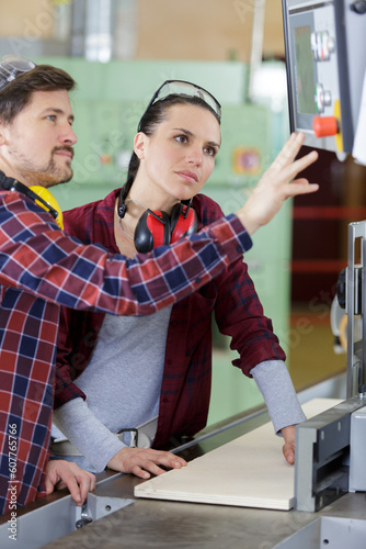 man and woman with machine cnc