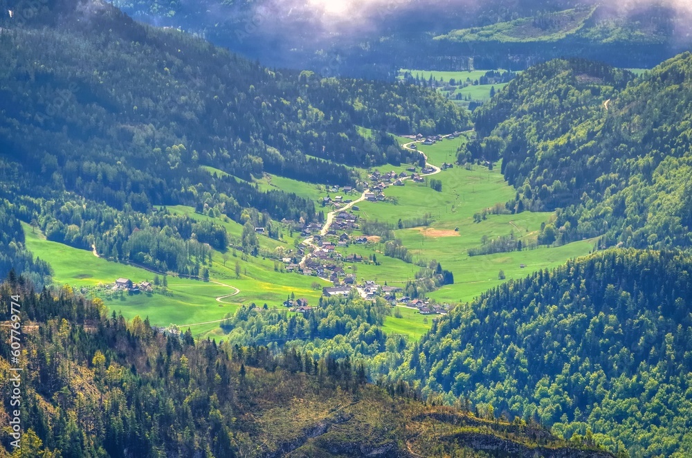 Village in Austrian mountains. Road winding through the village, view from Loser peak in Dead Mountains (Totes Gebirge) in Austria.