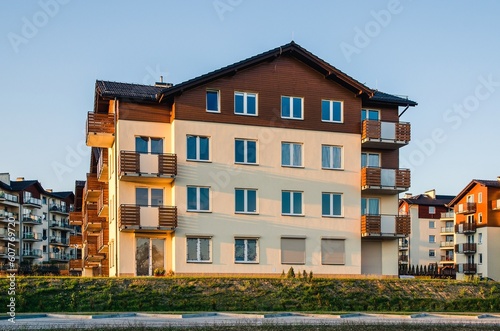 Obraz na płótnie New housing estates in Tychy City, Poland. Public view of newly built block of flats in the green area. w salonie