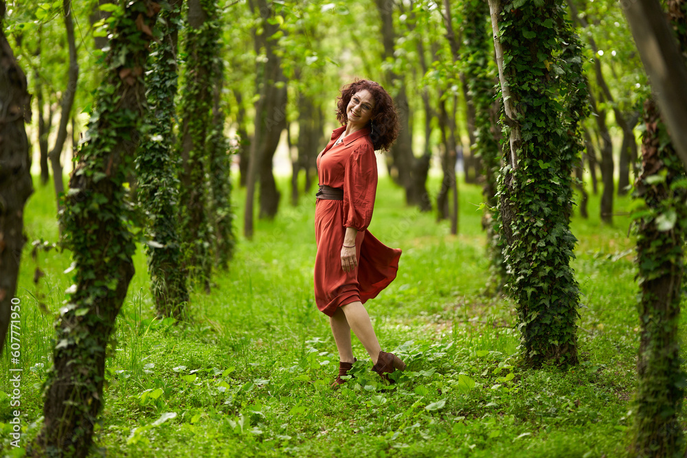 Candid of a mature curly hair redhead woman Candid of a mature curly hair redhead woman