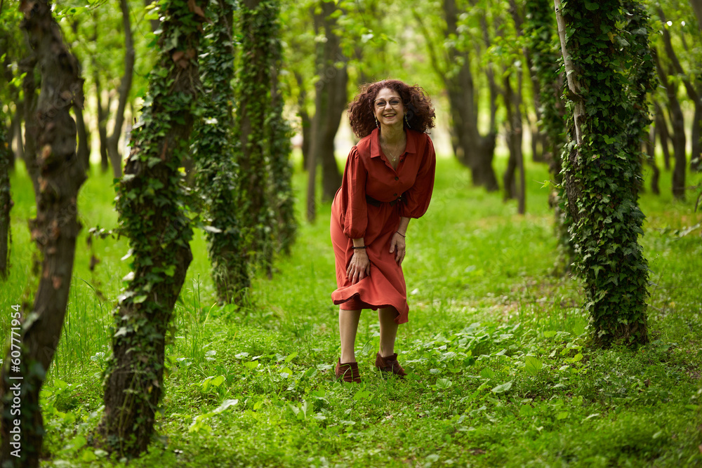 Candid of a mature curly hair redhead woman Candid of a mature curly hair redhead woman