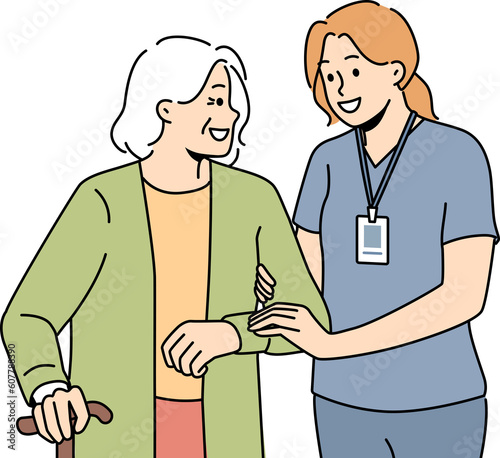 Caregiver help elderly woman with walking