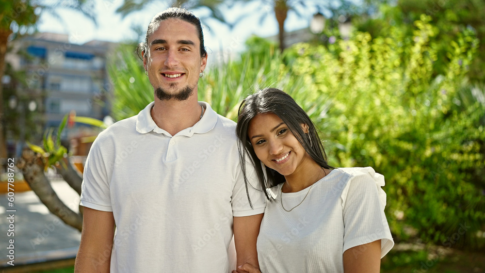 Man and woman couple smiling confident standing together at park Man and woman couple smiling confident standing together at park
