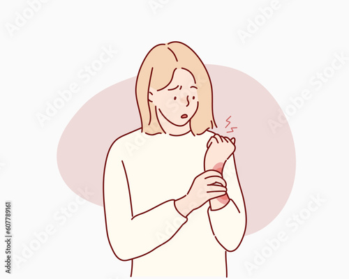 Tormented suffering from woman hurting holding painful wrist. Hand drawn style vector design illustrations.