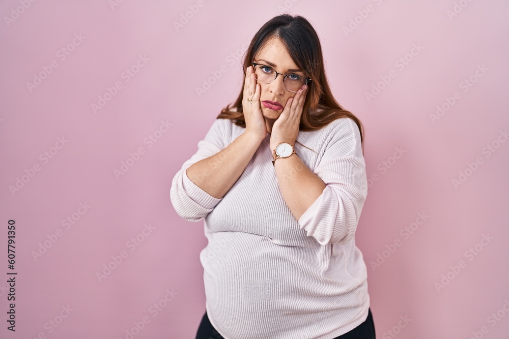 Pregnant woman standing over pink background tired hands covering face, depression and sadness, upset and irritated for problem Pregnant woman standing over pink background tired hands covering face, depression and sadness, upset and irritated for problem
