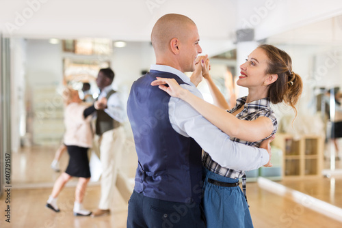 Happy man and woman enjoying ballroom dancing Fototapet