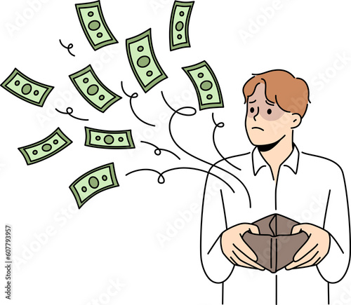 Frustrated man with money flow from wallet