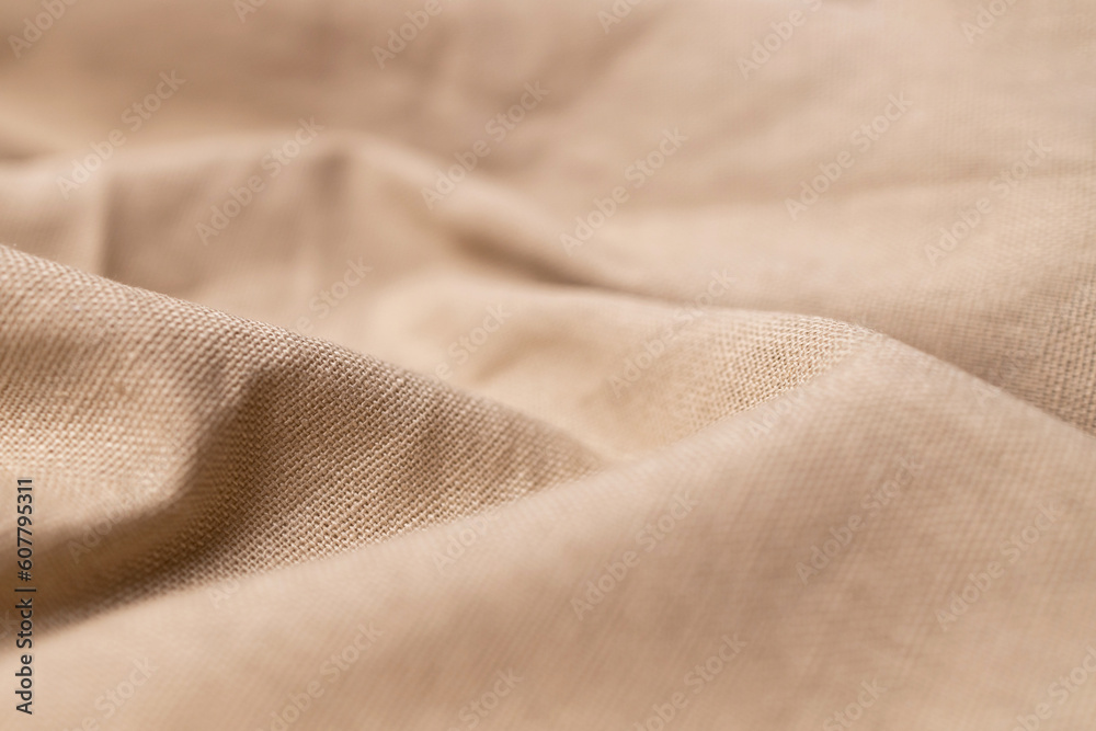 Fototapeta premium Natural linen fabric texture. Rough crumpled burlap background. Selective focus