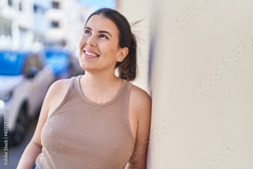 Free Download Young beautiful hispanic woman smiling confident looking to the side at street - GFXLoad