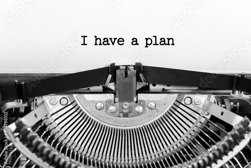 I have a plan phrase close up being typing and centered on a sheet of paper on old vintage typewriter mechanical
