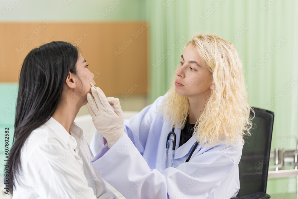woman consulting about Cosmetic surgeon and make Botox injections on face for beauty procedures. Plastic surgery in face of woman woman consulting about Cosmetic surgeon and make Botox injections on face for beauty procedures. Plastic surgery in face of woman