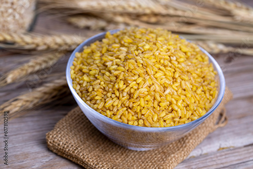 Dry raw bulgur in a glass bowl