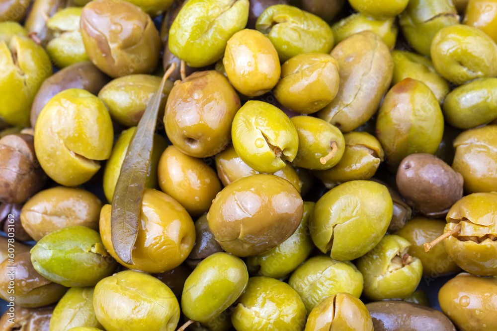 Cracked green olives. Cracked green olives with lemon. Turkish style olive (Turkish name; kirma zeytin) Cracked green olives. Cracked green olives with lemon. Turkish style olive (Turkish name; kirma zeytin)