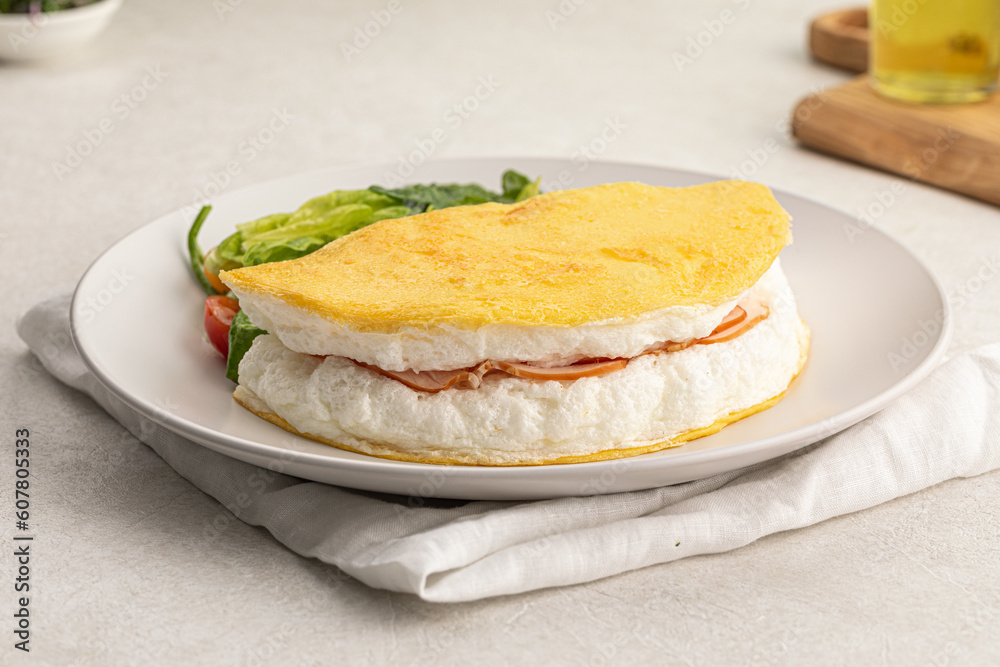 Portion of gourmet french airy poulard omelette breakfast Portion of gourmet french airy poulard omelette breakfast