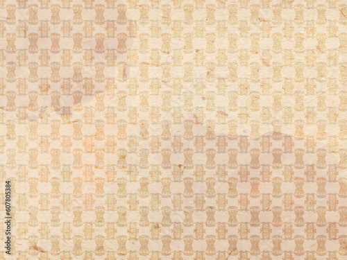 Old stained paper or wallpaper on the wall. Geometric abstract pattern in sepia colors. Vintage style. 