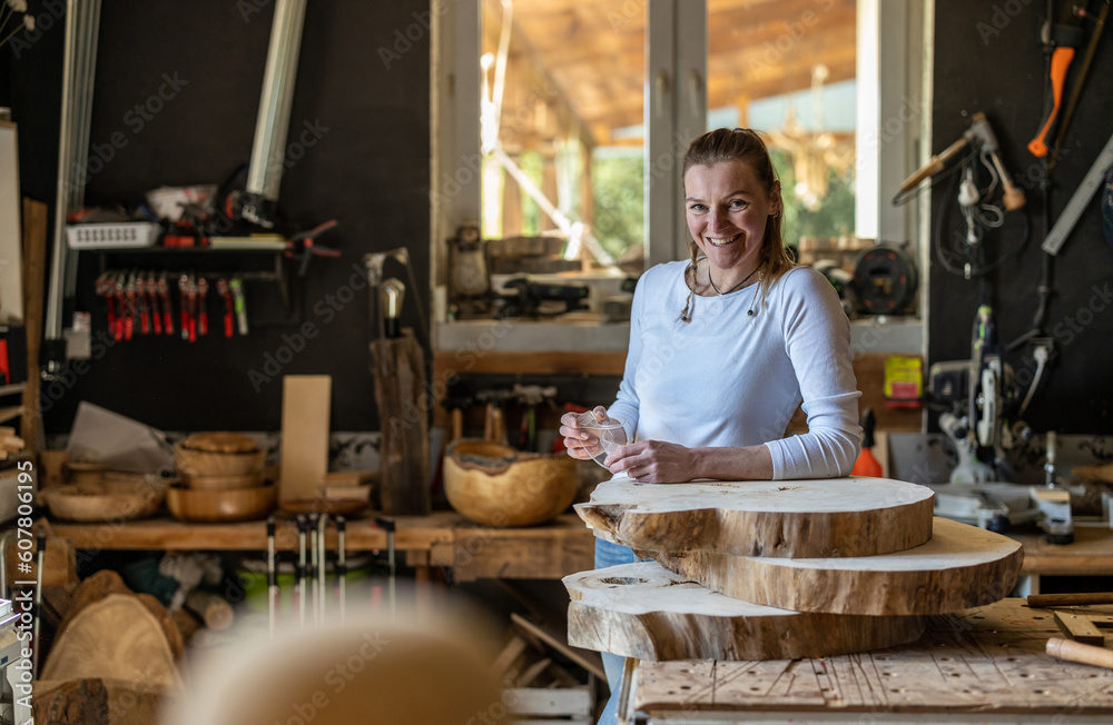 Portrait of confident craftswoman in her workshop
