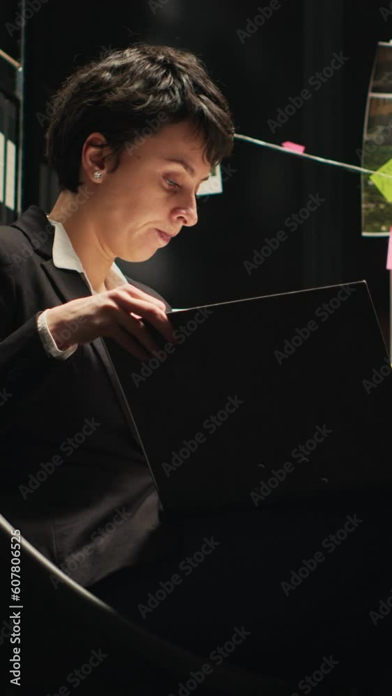 Vertical video Detective evaluates confidential police files to